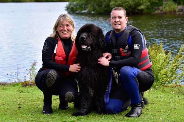 Black Newfoundland Maximus pictured with owners Ruth & Paul Dickinson